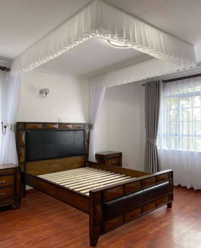 Close-up of the rail system of a modern mosquito net, showing smooth operation